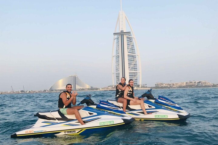 Experience the stunning Dubai skyline while jet skiing with iconic landmarks like Burj Al Arab and Burj Khalifa as your backdrop. An unforgettable adventure awaits on the water.